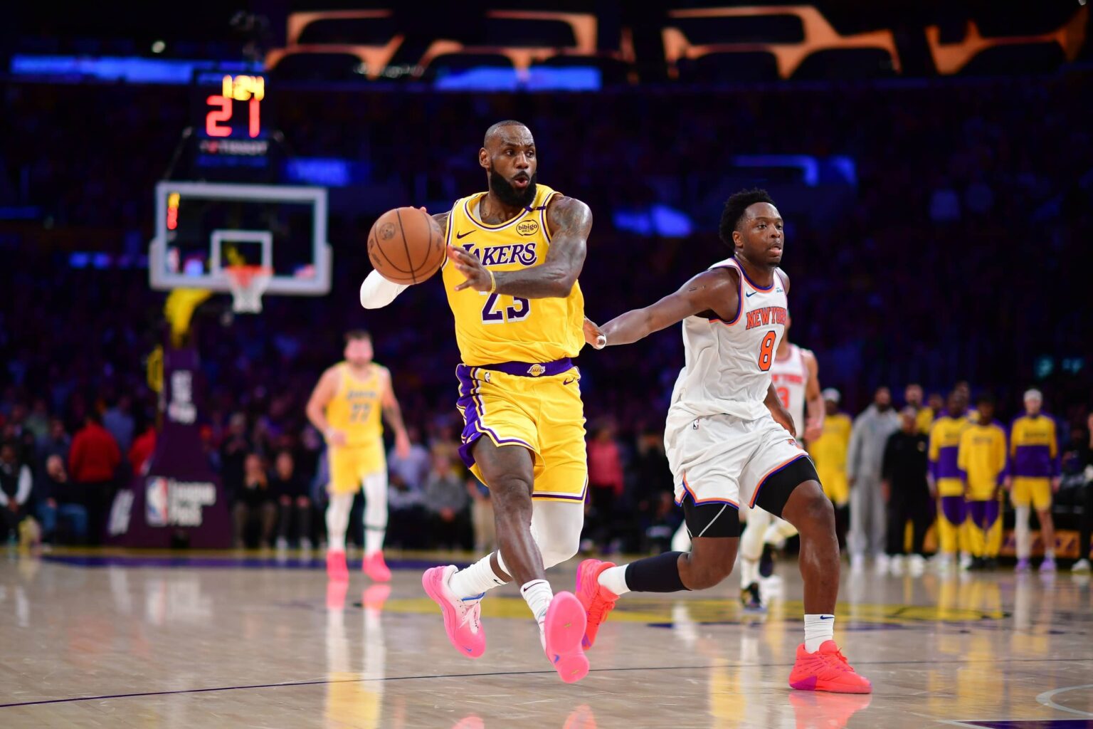 Mar 6, 2025; Los Angeles, California, USA; Los Angeles Lakers forward LeBron James (23) passes the ball ahead of New York Knicks forward OG Anunoby (8) during the second half at Crypto.com Arena. Mandatory Credit: Gary A. Vasquez-Imagn Images
