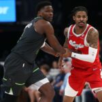 Apr 10, 2025; Memphis, Tennessee, USA; Minnesota Timberwolves guard Anthony Edwards (5) and Memphis Grizzlies guard Ja Morant (12) battle for position during the third quarter at FedExForum. Mandatory Credit: Petre Thomas-Imagn Images