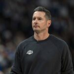 Apr 25, 2025; Minneapolis, Minnesota, USA; Los Angeles Lakers head coach JJ Redick looks on against the Minnesota Timberwolves in the first half during game three of first round for the 2024 NBA Playoffs at Target Center. Mandatory Credit: Jesse Johnson-Imagn Images