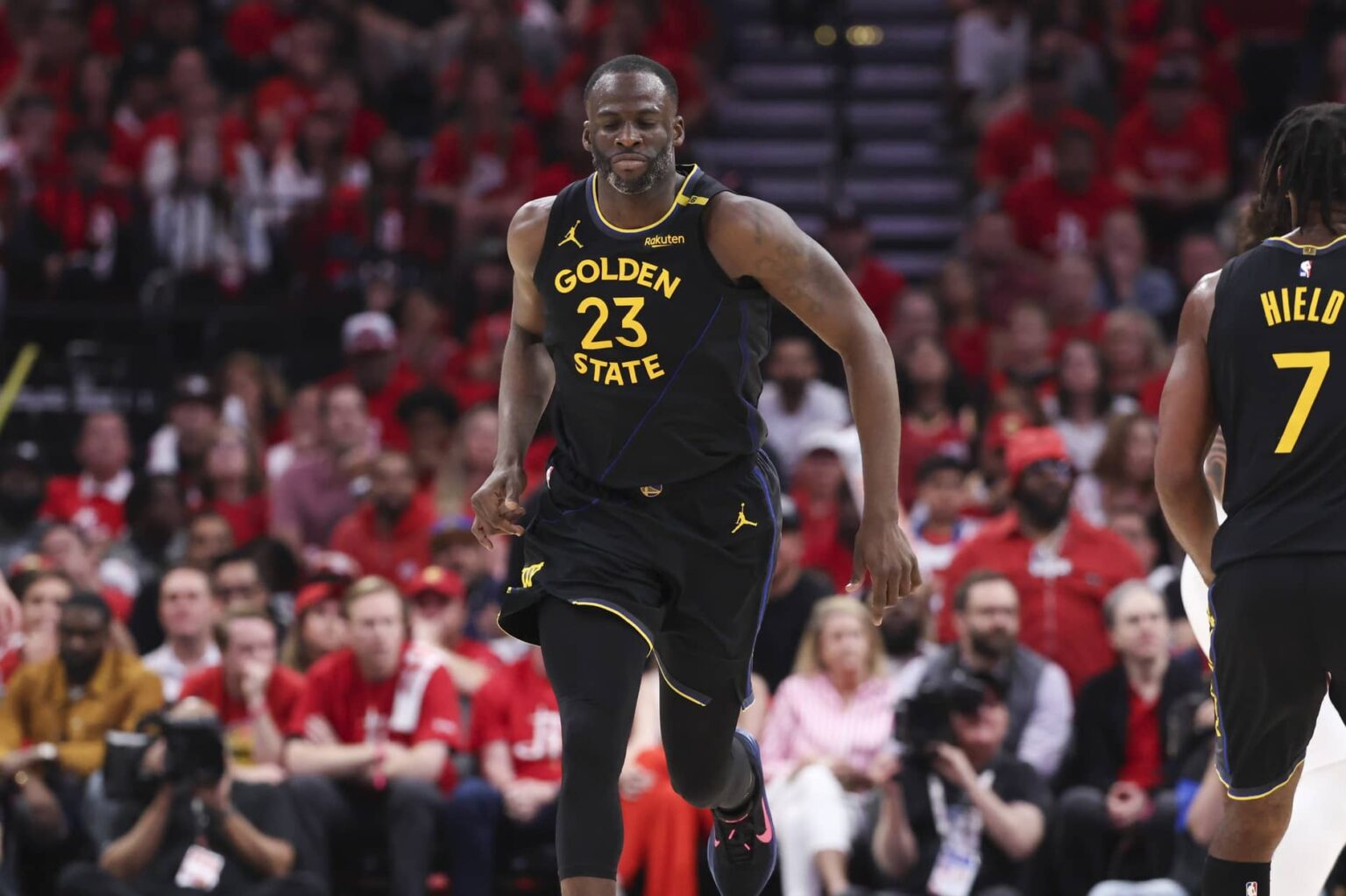 May 4, 2025; Houston, Texas, USA; Golden State Warriors forward Draymond Green (23) reacts after scoring a basket during the third quarter of game seven of the first round for the 2025 NBA Playoffs against the Houston Rockets at Toyota Center. Mandatory Credit: Troy Taormina-Imagn Images