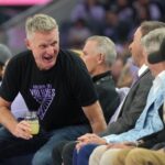 May 16, 2025; San Francisco, California, USA; Golden State Warriors head coach Steve Kerr (center left) talks with owner Joe Lacob (center right) during the third quarter of the game between the Golden State Valkyries and the Los Angeles Sparks at Chase Center. Mandatory Credit: Darren Yamashita-Imagn Images