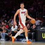 Oct 6, 2025; Miami, Florida, USA; Miami Heat forward Nikola Jovic (5) dribbles the basketball against the Milwaukee Bucks during the second quarter at Kaseya Center. Mandatory Credit: Sam Navarro-Imagn Images