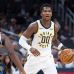 Oct 11, 2025; Indianapolis, Indiana, USA; Indiana Pacers guard/forward Bennedict Mathurin (00) dribbles the ball while Oklahoma City Thunder guard Cason Wallace (22) defends in the first half at Gainbridge Fieldhouse. Mandatory Credit: Trevor Ruszkowski-Imagn Images