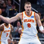 Oct 31, 2025; Indianapolis, Indiana, USA; Atlanta Hawks center Kristaps Porzingis (8) holds the ball while Indiana Pacers forward Isaiah Jackson (22) defends in the first half at Gainbridge Fieldhouse. Mandatory Credit: Trevor Ruszkowski-Imagn Images
