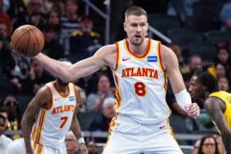 Oct 31, 2025; Indianapolis, Indiana, USA; Atlanta Hawks center Kristaps Porzingis (8) holds the ball while Indiana Pacers forward Isaiah Jackson (22) defends in the first half at Gainbridge Fieldhouse. Mandatory Credit: Trevor Ruszkowski-Imagn Images