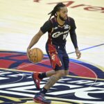 Nov 5, 2025; Cleveland, Ohio, USA; Cleveland Cavaliers guard Darius Garland (10) brings the ball up court in the fourth quarter against the Philadelphia 76ers at Rocket Arena. Mandatory Credit: David Richard-Imagn Images