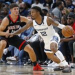 Nov 5, 2025; Memphis, Tennessee, USA; Memphis Grizzlies guard Ja Morant (12) dribbles as Houston Rockets guard Reed Sheppard (15) defends during the fourth quarter at FedExForum. Mandatory Credit: Petre Thomas-Imagn Images