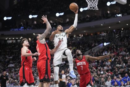 Nov 9, 2025; Milwaukee, Wisconsin, USA; Milwaukee Bucks forward Giannis Antetokounmpo (34) drives to the basket against Houston Rockets center Steven Adams (12) and Houston Rockets forward Kevin Durant (7) in the second half at Fiserv Forum. Mandatory Credit: Michael McLoone-Imagn Images