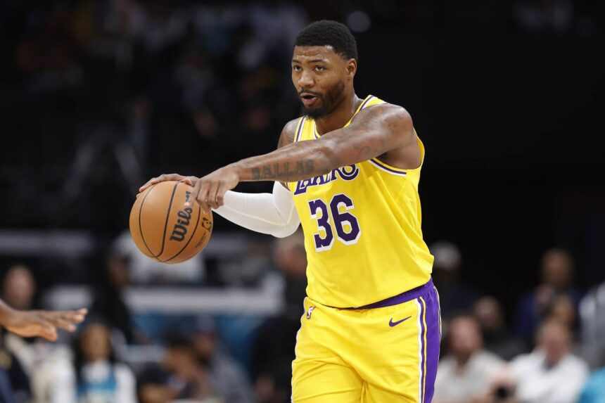 Nov 10, 2025; Charlotte, North Carolina, USA; Los Angeles Lakers guard Marcus Smart (36) directs the offense during the second quarter against the Charlotte Hornets at Spectrum Center. Mandatory Credit: Brian Westerholt-Imagn Images