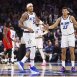 Nov 10, 2025; Orlando, Florida, USA; Orlando Magic forward Paolo Banchero (5) and forward Tristan da Silva (23) react after a play against the Portland Trail Blazers in the third quarter at Kia Center. Mandatory Credit: Nathan Ray Seebeck-Imagn Images