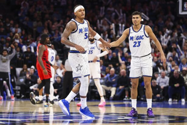 Nov 10, 2025; Orlando, Florida, USA; Orlando Magic forward Paolo Banchero (5) and forward Tristan da Silva (23) react after a play against the Portland Trail Blazers in the third quarter at Kia Center. Mandatory Credit: Nathan Ray Seebeck-Imagn Images