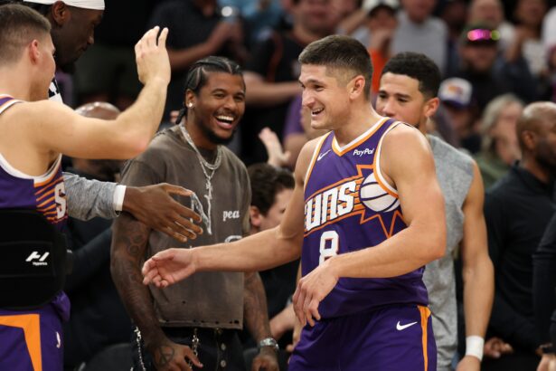 Nov 10, 2025; Phoenix, Arizona, USA; Phoenix Suns guard Grayson Allen (8) celebrates with teammates after being pulled from the game after setting the franchise record for three pointers in a game against the New Orleans Pelicans in the second half at the Mortgage Matchup Center. Mandatory Credit: Mark J. Rebilas-Imagn Images
