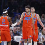 Nov 11, 2025; Oklahoma City, Oklahoma, USA; Oklahoma City Thunder center Chet Holmgren (7) and Oklahoma City Thunder guard Shai Gilgeous-Alexander (2) celebrate after scoring against the Golden State Warriors during the second half at Paycom Center. Mandatory Credit: Alonzo Adams-Imagn Images