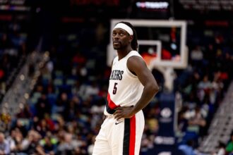 New Orleans, Louisiana, USA; Portland Trail Blazers guard Jrue Holiday (5) looks on against the New Orleans Pelicans during the second half at Smoothie King Center. Mandatory Credit: Stephen Lew-Imagn Images