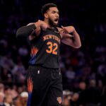 Nov 14, 2025; New York, New York, USA; New York Knicks center Karl-Anthony Towns (32) reacts during the first quarter against the Miami Heat at Madison Square Garden. Mandatory Credit: Brad Penner-Imagn Images