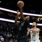 Nov 16, 2025; New Orleans, Louisiana, USA; New Orleans Pelicans forward Herbert Jones (2) shoots against Golden State Warriors guard Stephen Curry (30) during the first half at Smoothie King Center. Mandatory Credit: Matthew Hinton-Imagn Images