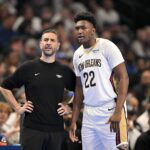Nov 21, 2025; Dallas, Texas, USA; New Orleans Pelicans head coach James Borrego talks with center Derik Queen (22) during the first quarter against the Dallas Mavericks at the American Airlines Center. Mandatory Credit: Jerome Miron-Imagn Images