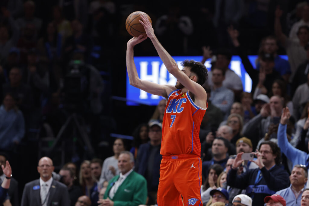 Nov 26, 2025; Oklahoma City, Oklahoma, USA; Oklahoma City Thunder center Chet Holmgren (7) shoots a three point basket against the Minnesota Timberwolves during the second half at Paycom Center. Mandatory Credit: Alonzo Adams-Imagn Images
