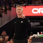 Nov 26, 2025; San Francisco, California, USA; Golden State Warriors head coach Steve Kerr watches the scoreboard against the Houston Rockets in the second quarter at Chase Center. Mandatory Credit: David Gonzales-Imagn Images