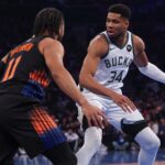 Nov 28, 2025; New York, New York, USA; Milwaukee Bucks forward Giannis Antetokounmpo (34) dribbles as New York Knicks guard Jalen Brunson (11) defends during the first half at Madison Square Garden. Mandatory Credit: Vincent Carchietta-Imagn Images