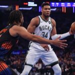 Nov 28, 2025; New York, New York, USA; Milwaukee Bucks forward Giannis Antetokounmpo (34) looks to pass as New York Knicks guard Jalen Brunson (11) defends during the first half at Madison Square Garden. Mandatory Credit: Vincent Carchietta-Imagn Images