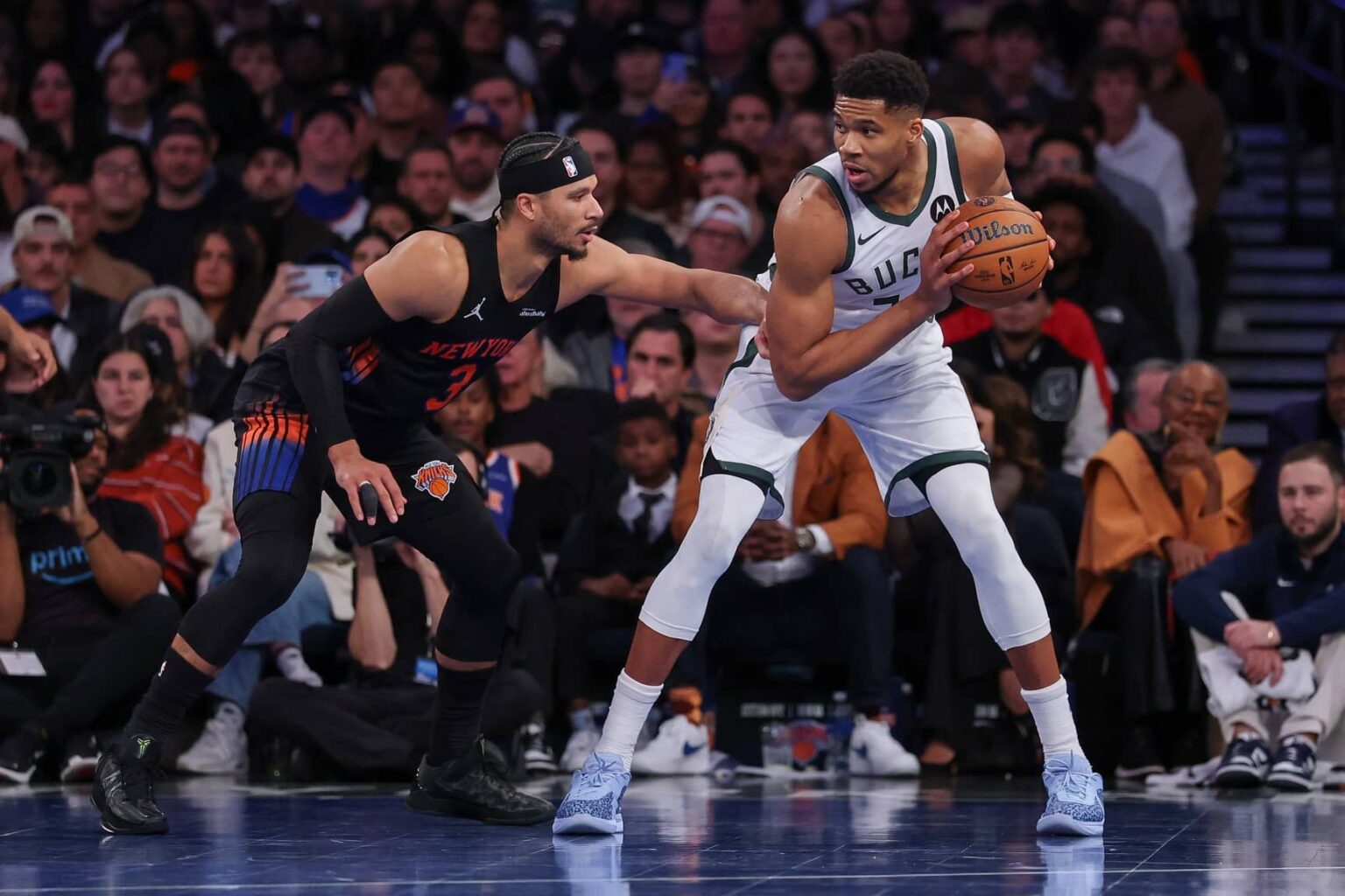 Nov 28, 2025; New York, New York, USA; Milwaukee Bucks forward Giannis Antetokounmpo (34) is guarded by New York Knicks guard Josh Hart (3) during the second half at Madison Square Garden. Mandatory Credit: Vincent Carchietta-Imagn Images
