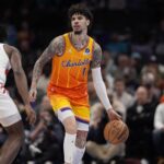 Nov 29, 2025; Charlotte, North Carolina, USA; Charlotte Hornets guard LaMelo Ball (1) brings the ball up court defended by Toronto Raptors guard Immanuel Quickley (5) during the first quarter at Spectrum Center. Mandatory Credit: Jim Dedmon-Imagn Images