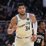 Nov 29, 2025; Milwaukee, Wisconsin, USA; Milwaukee Bucks forward Giannis Antetokounmpo (34) reacts after scoring his 21,000th career point in the third quarter against the Brooklyn Nets at Fiserv Forum. Mandatory Credit: Benny Sieu-Imagn Images