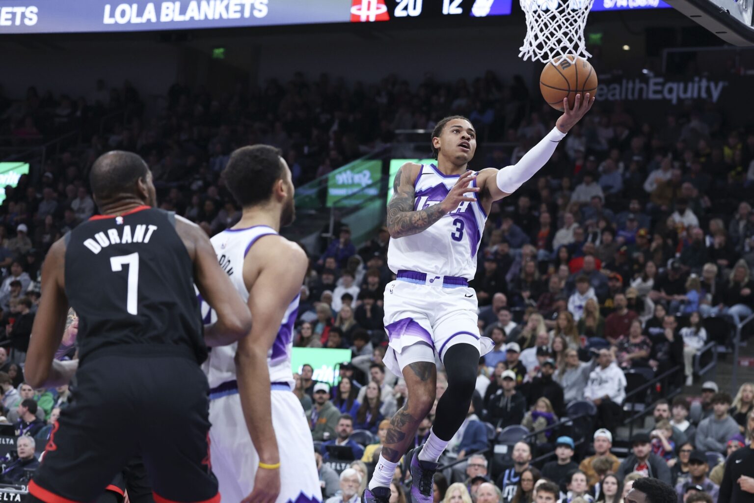 Nov 30, 2025; Salt Lake City, Utah, USA; Utah Jazz guard Keyonte George (3) lays the ball up against the Houston Rockets during the first quarter at Delta Center. Mandatory Credit: Rob Gray-Imagn Images