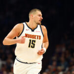 Nov 29, 2025; Phoenix, Arizona, USA; Denver Nuggets center Nikola Jokic (15) against the Phoenix Suns at the Mortgage Matchup Center. Mandatory Credit: Mark J. Rebilas-Imagn Images