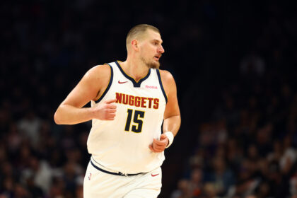 Nov 29, 2025; Phoenix, Arizona, USA; Denver Nuggets center Nikola Jokic (15) against the Phoenix Suns at the Mortgage Matchup Center. Mandatory Credit: Mark J. Rebilas-Imagn Images