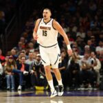 Nov 29, 2025; Phoenix, Arizona, USA; Denver Nuggets center Nikola Jokic (15) against the Phoenix Suns at the Mortgage Matchup Center. Mandatory Credit: Mark J. Rebilas-Imagn Images