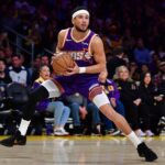 Dec 1, 2025; Los Angeles, California, USA; Phoenix Suns guard Devin Booker (1) controls the ball against the against the Los Angeles Lakers during the first half at Crypto.com Arena. Mandatory Credit: Gary A. Vasquez-Imagn Images