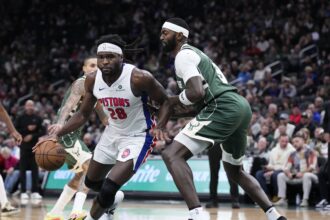 Dec 3, 2025; Milwaukee, Wisconsin, USA; Detroit Pistons forward Isaiah Stewart (28) drives to the basket against Milwaukee Bucks forward Bobby Portis (9) in the second half and was later ejected in the second half at Fiserv Forum. Mandatory Credit: Michael McLoone-Imagn Images