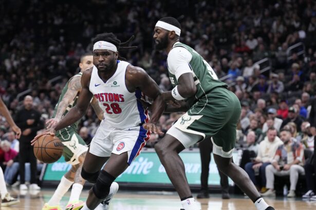 Dec 3, 2025; Milwaukee, Wisconsin, USA; Detroit Pistons forward Isaiah Stewart (28) drives to the basket against Milwaukee Bucks forward Bobby Portis (9) in the second half and was later ejected in the second half at Fiserv Forum. Mandatory Credit: Michael McLoone-Imagn Images