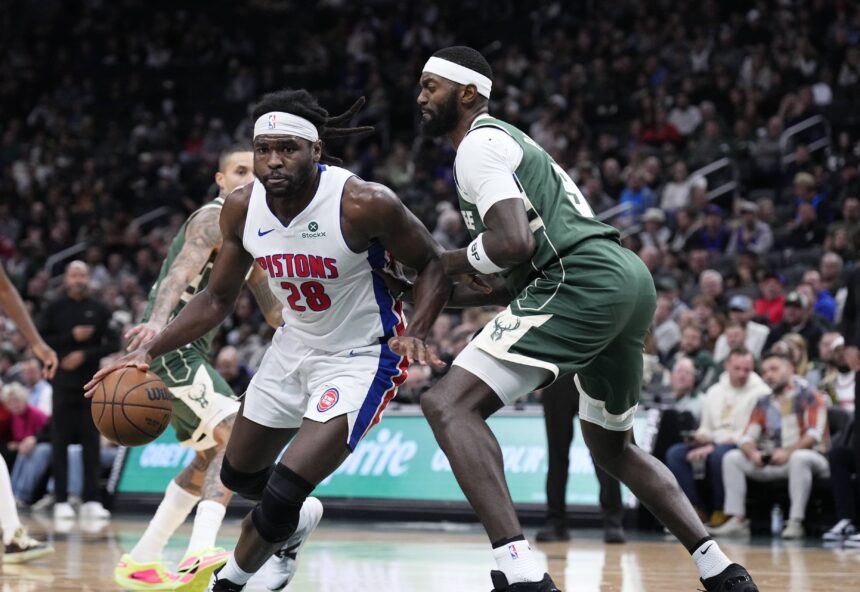 Dec 3, 2025; Milwaukee, Wisconsin, USA; Detroit Pistons forward Isaiah Stewart (28) drives to the basket against Milwaukee Bucks forward Bobby Portis (9) in the second half and was later ejected in the second half at Fiserv Forum. Mandatory Credit: Michael McLoone-Imagn Images