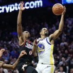 Dec 4, 2025; Philadelphia, Pennsylvania, USA; Philadelphia 76ers guard Tyrese Maxey (0) blocks the final shot of the game by Golden State Warriors guard De'Anthony Melton (8) to secure the victory at Xfinity Mobile Arena. Mandatory Credit: Bill Streicher-Imagn Images