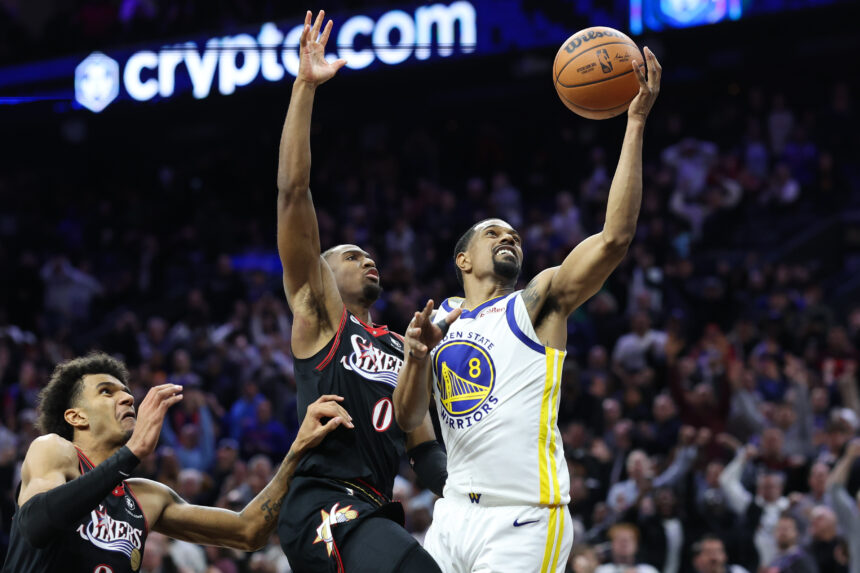 Dec 4, 2025; Philadelphia, Pennsylvania, USA; Philadelphia 76ers guard Tyrese Maxey (0) blocks the final shot of the game by Golden State Warriors guard De'Anthony Melton (8) to secure the victory at Xfinity Mobile Arena. Mandatory Credit: Bill Streicher-Imagn Images