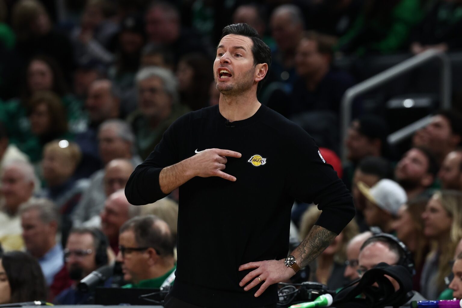 Dec 5, 2025; Boston, Massachusetts, USA; Los Angeles Lakers head coach JJ Redick signals to his players during the first half against the Boston Celtics at TD Garden. Mandatory Credit: Winslow Townson-Imagn Images