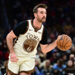 Dec 6, 2025; Cleveland, Ohio, USA; Golden State Warriors guard Pat Spencer (61) brings the ball up court against the Cleveland Cavaliers during the second half at Rocket Arena. Mandatory Credit: Ken Blaze-Imagn Images