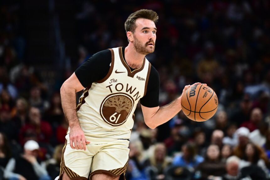 Dec 6, 2025; Cleveland, Ohio, USA; Golden State Warriors guard Pat Spencer (61) brings the ball up court against the Cleveland Cavaliers during the second half at Rocket Arena. Mandatory Credit: Ken Blaze-Imagn Images