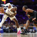 Dec 7, 2025; Philadelphia, Pennsylvania, USA; Los Angeles Lakers forward Lebron James (23) controls the ball against Philadelphia 76ers guard Tyrese Maxey during the first quarter at Xfinity Mobile Arena. Mandatory Credit: Bill Streicher-Imagn Images