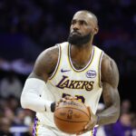 Dec 7, 2025; Philadelphia, Pennsylvania, USA; Los Angeles Lakers forward Lebron James (23) shoots against the Philadelphia 76ers during the fourth quarter at Xfinity Mobile Arena. Mandatory Credit: Bill Streicher-Imagn Images