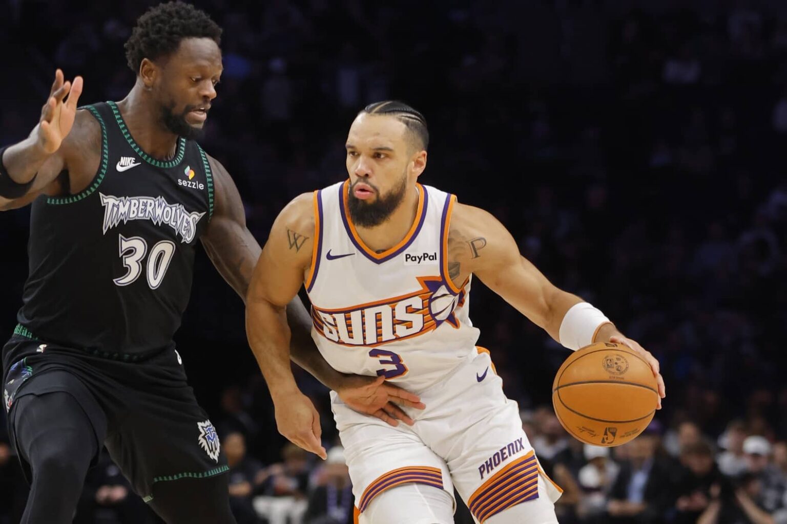 Dec 8, 2025; Minneapolis, Minnesota, USA; Phoenix Suns forward Dillon Brooks (3) works around Minnesota Timberwolves forward Julius Randle (30) in the first quarter at Target Center. Mandatory Credit: Bruce Kluckhohn-Imagn Images