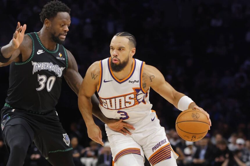 Dec 8, 2025; Minneapolis, Minnesota, USA; Phoenix Suns forward Dillon Brooks (3) works around Minnesota Timberwolves forward Julius Randle (30) in the first quarter at Target Center. Mandatory Credit: Bruce Kluckhohn-Imagn Images