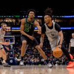 Dec 8, 2025; New Orleans, Louisiana, USA; San Antonio Spurs guard Stephon Castle (5) dribbles against New Orleans Pelicans forward Trey Murphy III (25) during the first half at Smoothie King Center. Mandatory Credit: Stephen Lew-Imagn Images