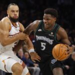 Dec 8, 2025; Minneapolis, Minnesota, USA; Minnesota Timberwolves guard Anthony Edwards (5) works around Phoenix Suns forward Dillon Brooks (3) in the third quarter at Target Center. Mandatory Credit: Bruce Kluckhohn-Imagn Images