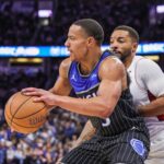 Dec 9, 2025; Orlando, Florida, USA; Orlando Magic guard Desmond Bane (3) drives to the basket against Miami Heat guard Norman Powell (24) during the second half at Kia Center. Mandatory Credit: Mike Watters-Imagn Images