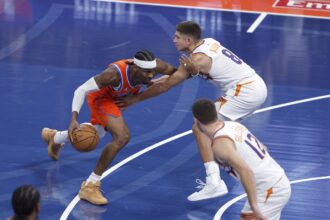 Dec 10, 2025; Oklahoma City, Oklahoma, USA; Oklahoma City Thunder guard Shai Gilgeous-Alexander (2) moves the ball past Phoenix Suns guard Grayson Allen (8) during the first quarter at Paycom Center. Mandatory Credit: Alonzo Adams-Imagn Images