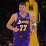 Dec 10, 2025; Los Angeles, California, USA; Los Angeles Lakers guard Luka Doncic (77) reacts after he was poked in the eye during the first half against the San Antonio Spurs at Crypto.com Arena. Mandatory Credit: Jayne Kamin-Oncea-Imagn Images